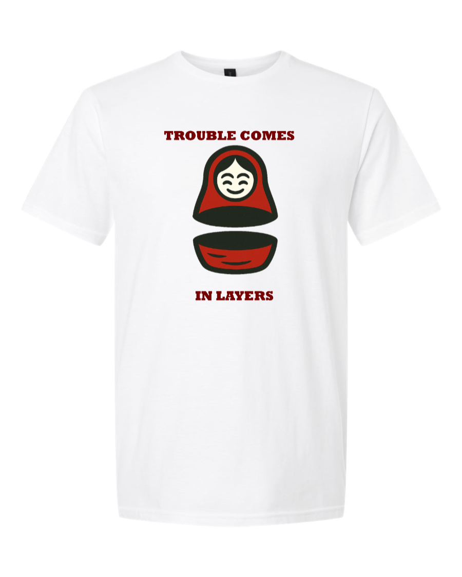 Split matryoshka doll with text “Trouble Comes in Layers.”